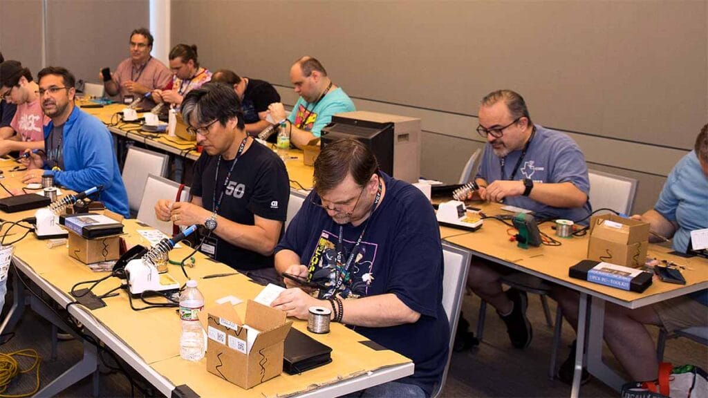 Vintage Computer Festival goers participate in a hands-on demonstration of circuit building.